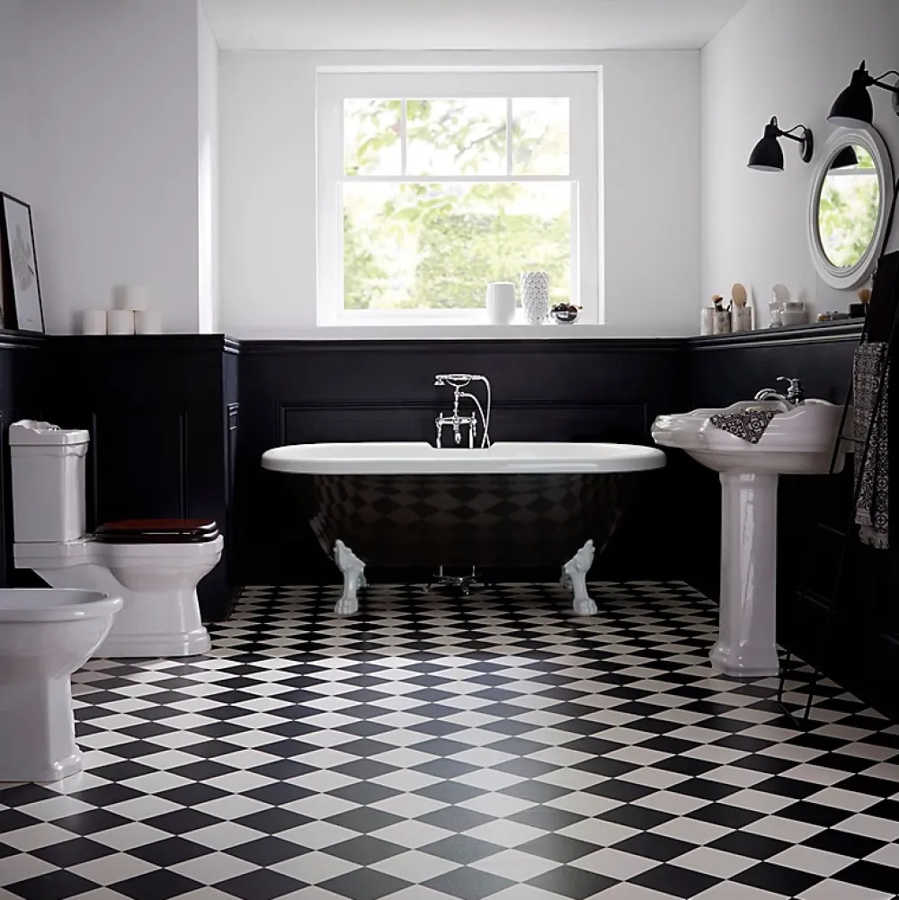 Planète Bain Baignoire ilot Charly ovale noire et blanche avec piétements blanc