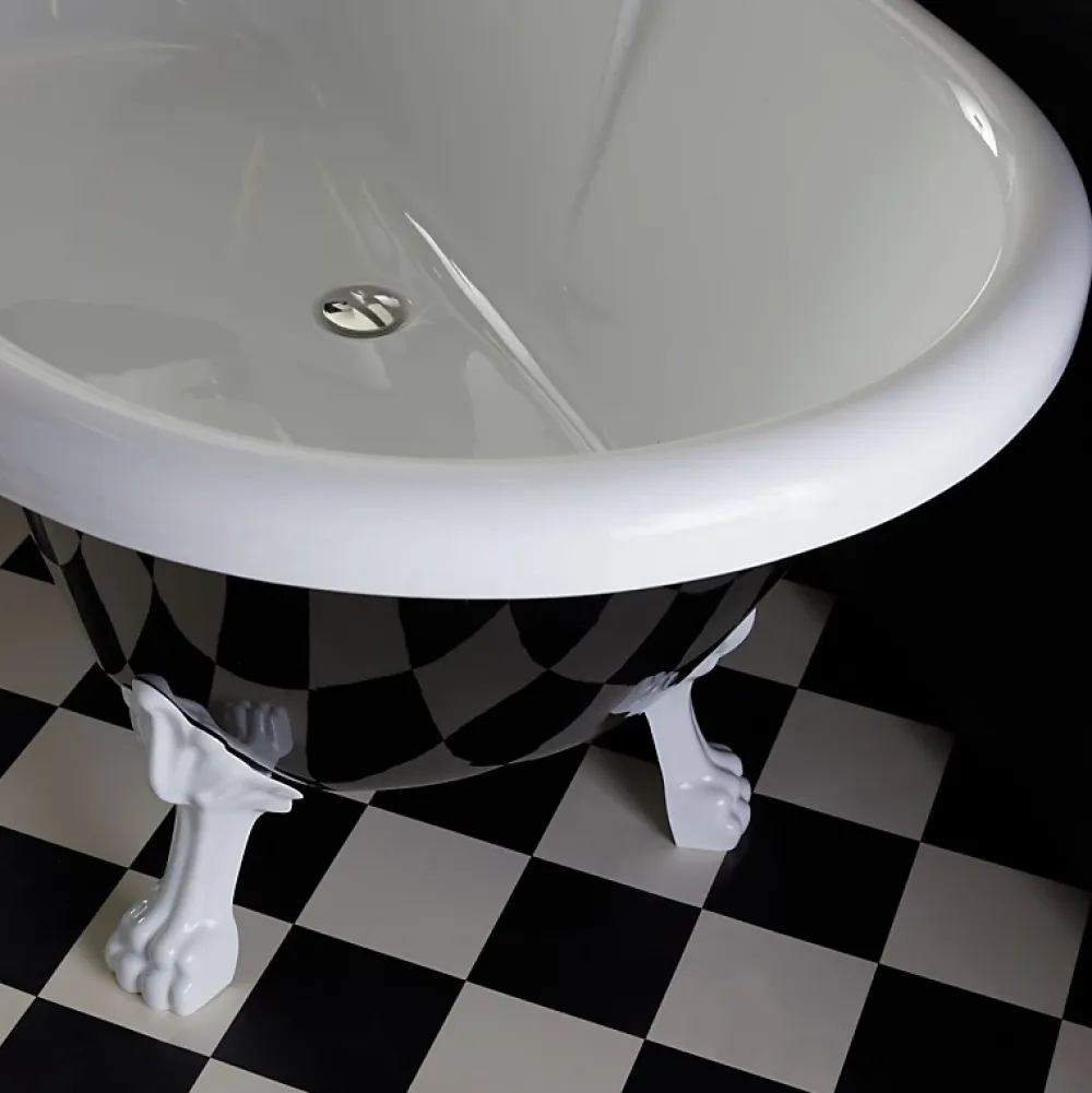 Planète Bain Baignoire ilot Charly ovale noire et blanche avec piétements blanc